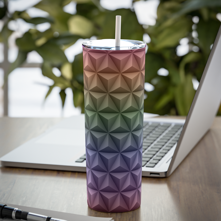 Rainbow skinny tumbler with textured triangles. The triangles are arranged in a pattern that gives off a 3D look. 